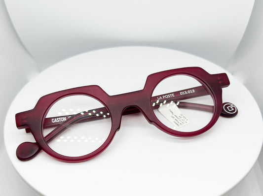 Buy Gaston Eyewear - La Poste, a  Burgundy; Acetate Optical Frame with a Round with Flat Top shape. An Authorized Dealer, Adair Eyewear has a 40+ Years History of Customer Service Excellence