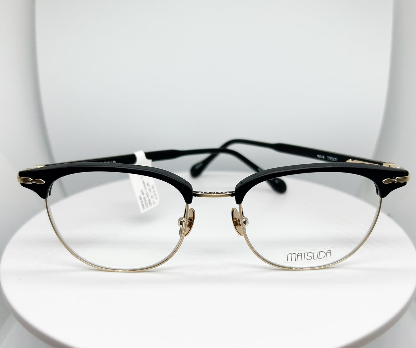 <p>Matsuda  M2048 is a  Matte Black & Brushed Gold, Titanium & Acetate Optical Frame with a Clubmaster shape.</p><p>Shop with confidence from Adair Eyewear, a MATSUDA Authorized Dealer.  We have provided the best in customer service and great designer eyweear for over 40 years.</p>